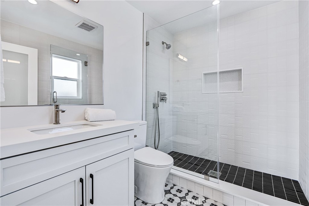 2405 Mathews Avenue, Unit B Redondo Beach, CA 90278 - Photo 44 of 46 a bathroom with a sink a toilet and shower