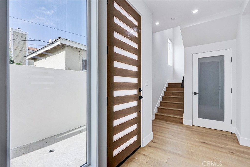 2405 Mathews Avenue, Unit B Redondo Beach, CA 90278 - Photo 7 of 46 a view of a hallway with wooden floor and staircase