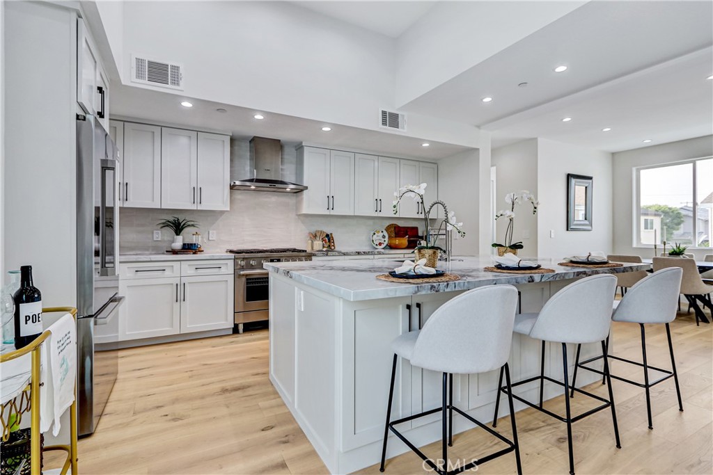 2405 Mathews Avenue, Unit B Redondo Beach, CA 90278 - Photo 9 of 46 a kitchen with a table chairs sink and cabinets