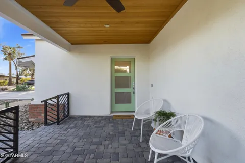 a swimming pool with outdoor seating and yard