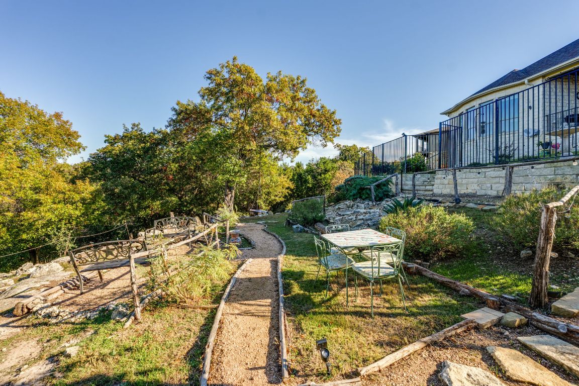306 Tavish Trail Austin, TX 78738 - Photo 14 of 40 a view of a chairs and table in patio
