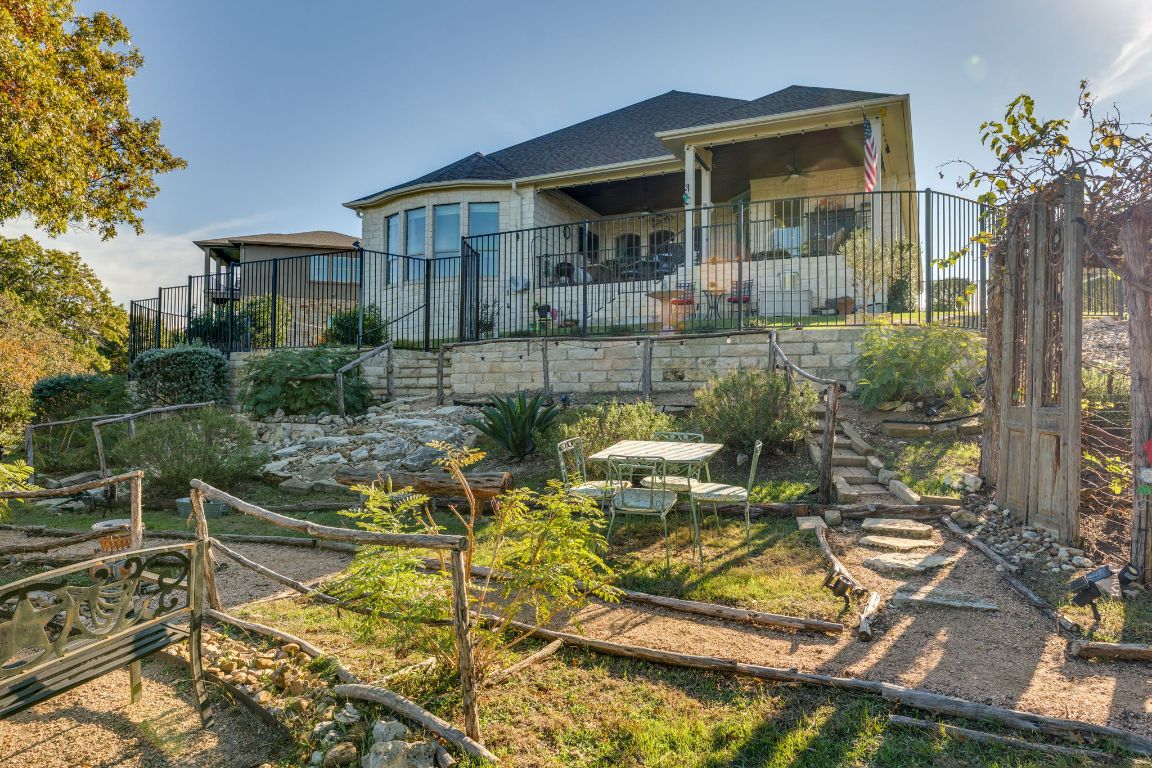 306 Tavish Trail Austin, TX 78738 - Photo 15 of 40 a view of backyard of house with outdoor seating