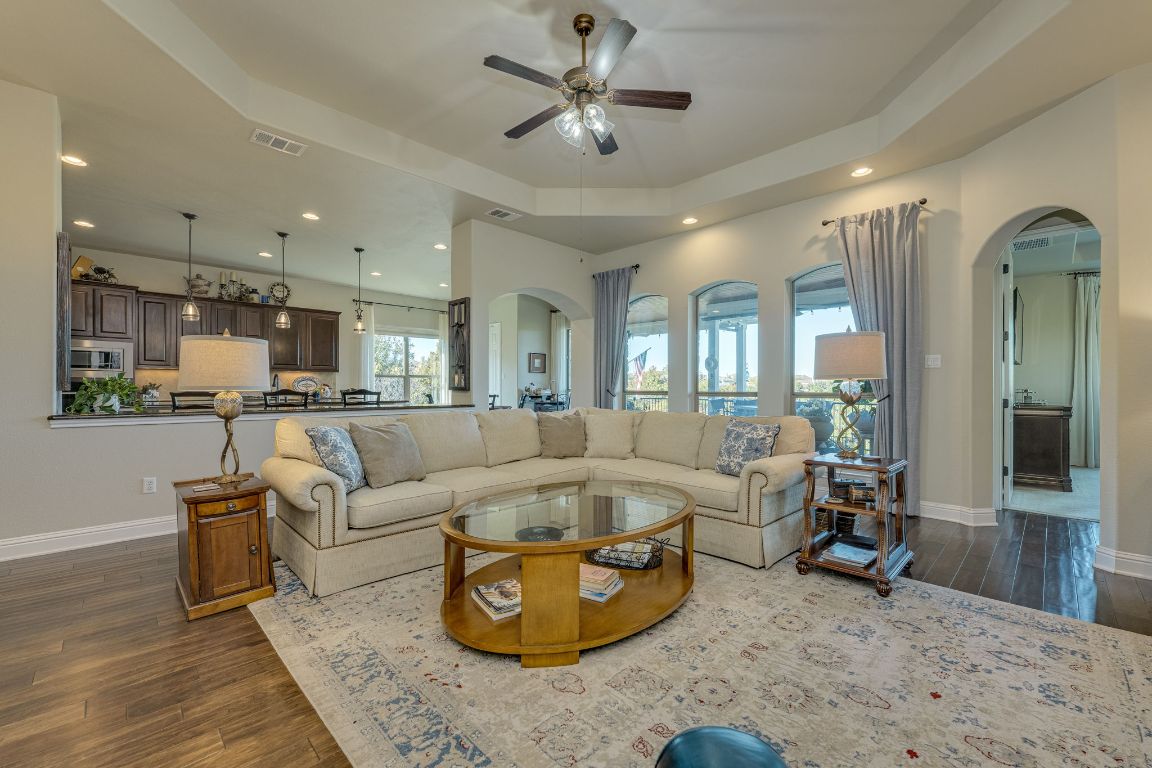 306 Tavish Trail Austin, TX 78738 - Photo 19 of 40 a living room with furniture and a view of kitchen