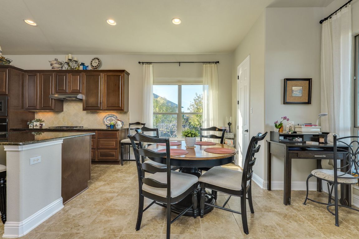 306 Tavish Trail Austin, TX 78738 - Photo 24 of 40 a view of a dining room with furniture
