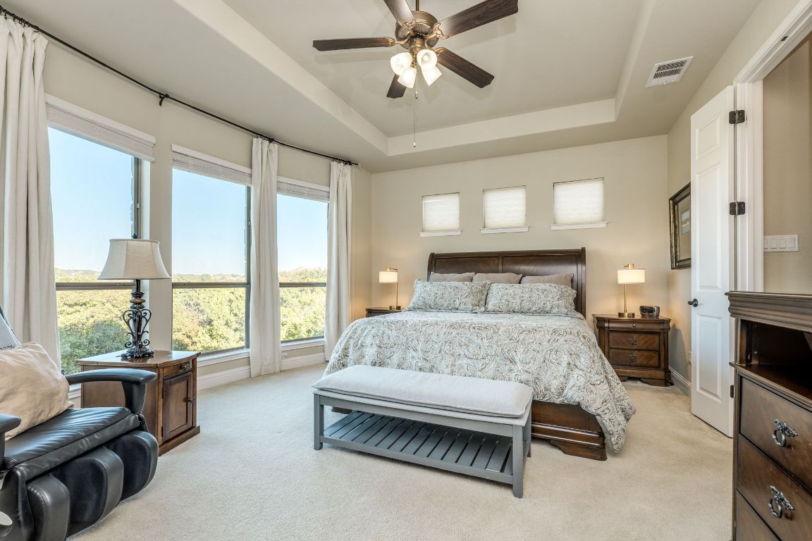 306 Tavish Trail Austin, TX 78738 - Photo 26 of 40 a bedroom with a bed and a couch