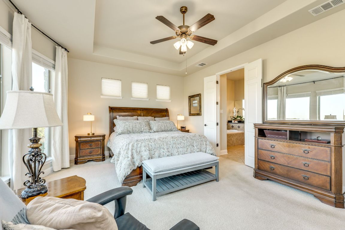 306 Tavish Trail Austin, TX 78738 - Photo 27 of 40 a bedroom with a bed and furniture