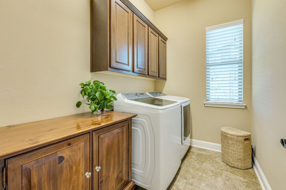 306 Tavish Trail Austin, TX 78738 - Photo 35 of 40 a utility room with a sink a washer and dryer