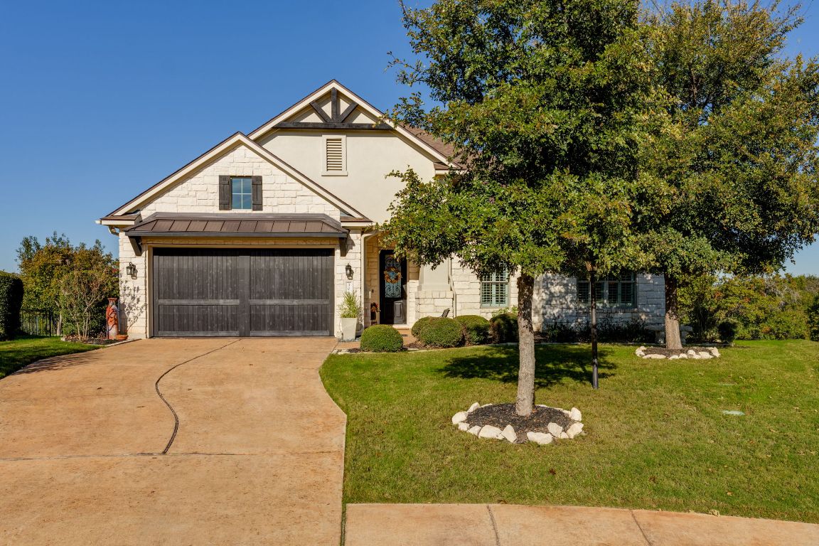 306 Tavish Trail Austin, TX 78738 - Photo 7 of 40 a front view of a house with a yard