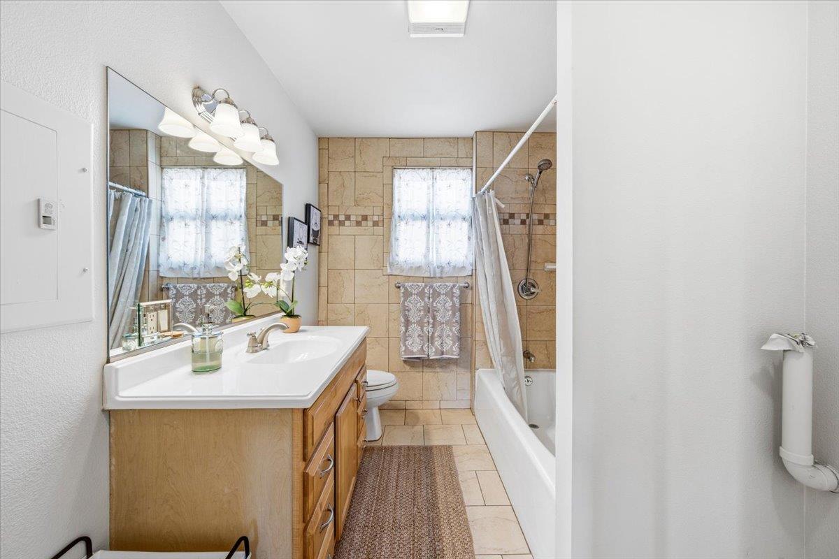 232 Upper Slate Creek Road Grass Valley, CA 95945 - Photo 20 of 48 a bathroom with a sink a mirror and a shower