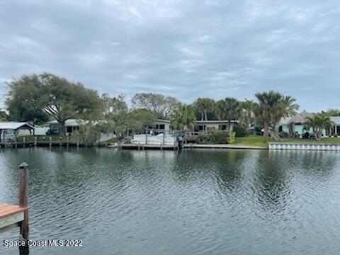 1011 Bali Road Cocoa Beach, FL 32931 - Photo 3 of 6 a view of a lake with houses