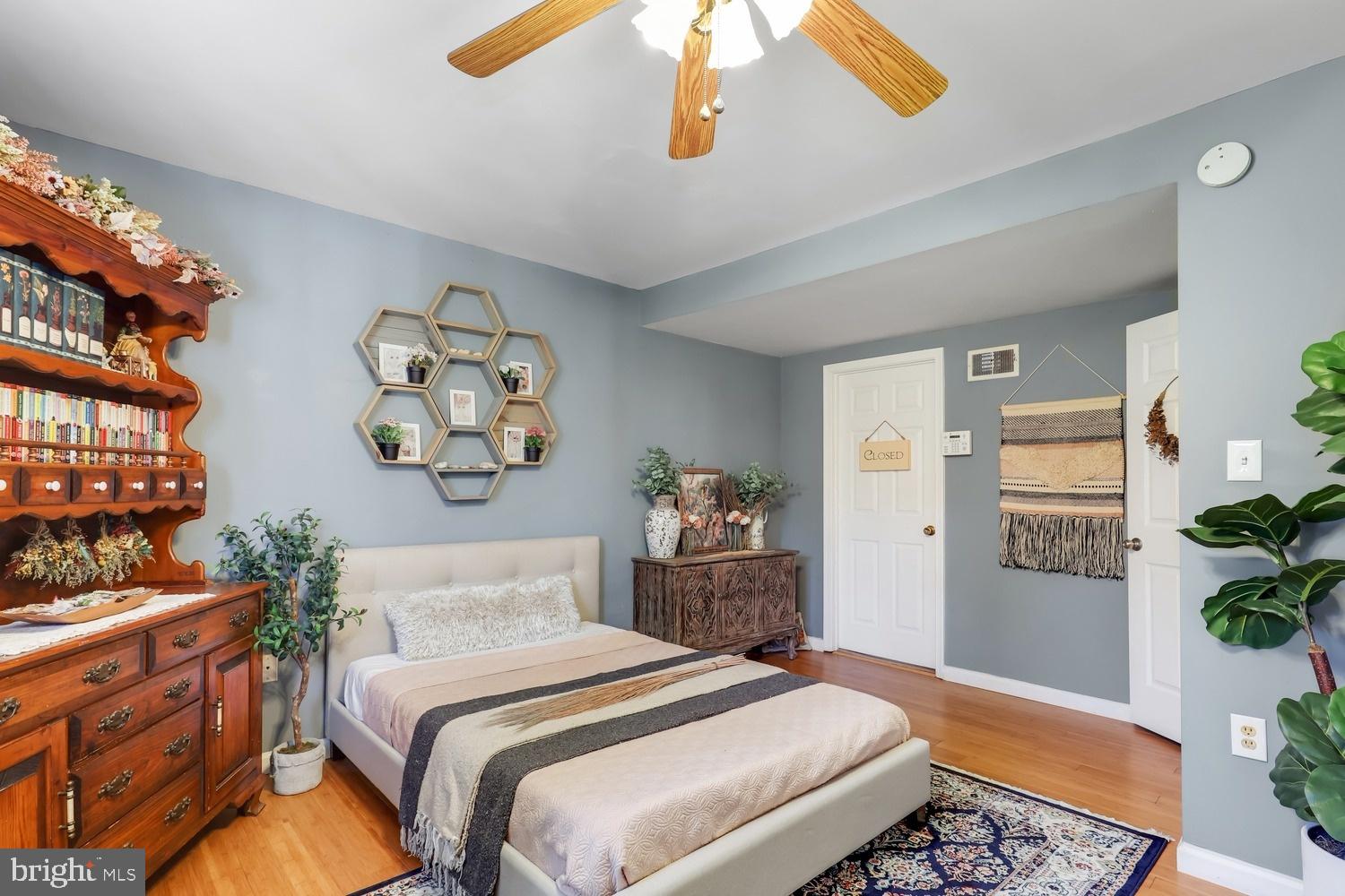 13705 Kerrydale Road Woodbridge, VA 22193 - Photo 14 of 32 a bedroom with a bed and wooden floor