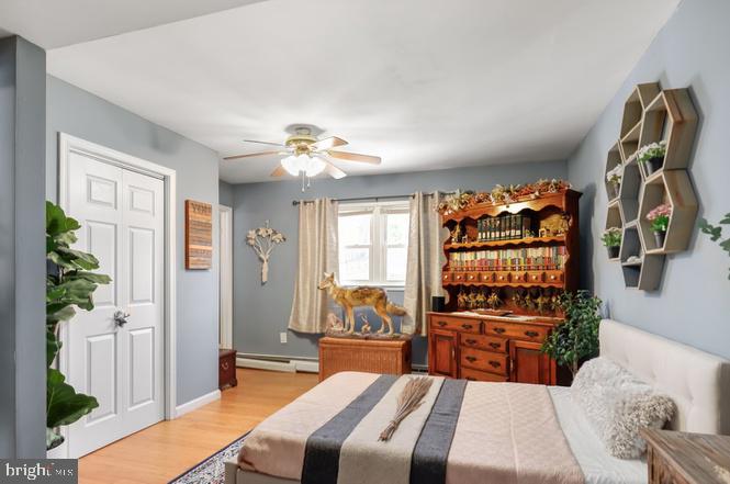 13705 Kerrydale Road Woodbridge, VA 22193 - Photo 15 of 32 a bedroom with a bed and a chandelier