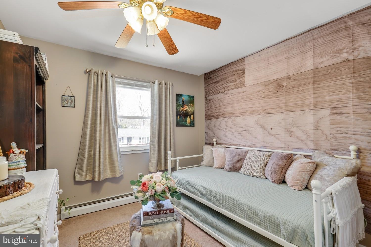 13705 Kerrydale Road Woodbridge, VA 22193 - Photo 17 of 32 a bedroom with a bed and a chandelier