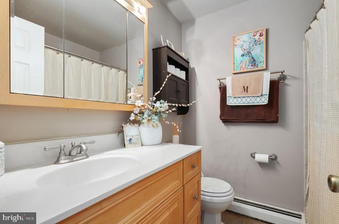 13705 Kerrydale Road Woodbridge, VA 22193 - Photo 19 of 32 a bathroom with a toilet sink and mirror
