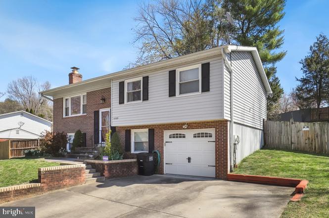 13705 Kerrydale Road Woodbridge, VA 22193 - Photo 2 of 32 a view of a house with a yard