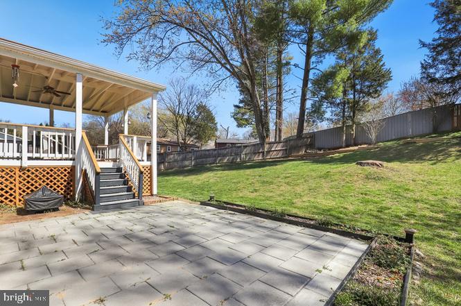 13705 Kerrydale Road Woodbridge, VA 22193 - Photo 26 of 32 a view of a backyard with a small cabin