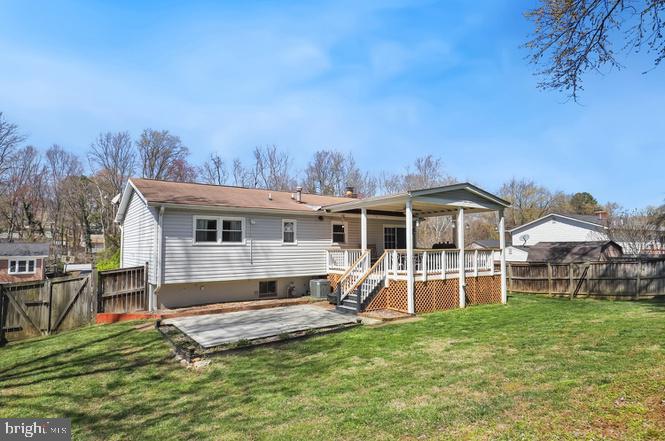 13705 Kerrydale Road Woodbridge, VA 22193 - Photo 27 of 32 a view of a house with a big yard and large trees