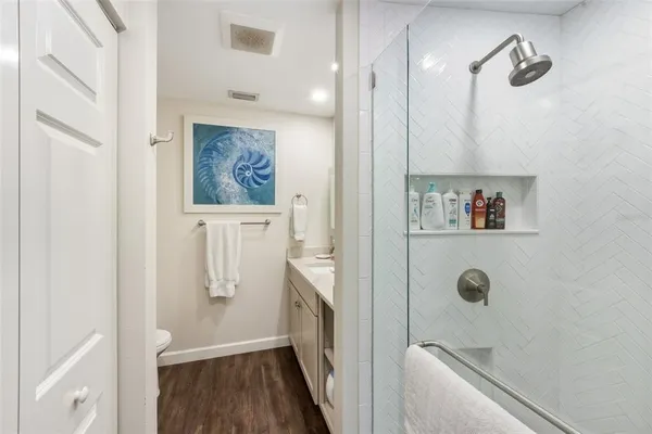 a bathroom with a tub and shower