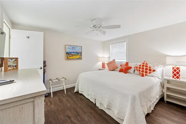 a bedroom with a bed and a table in it