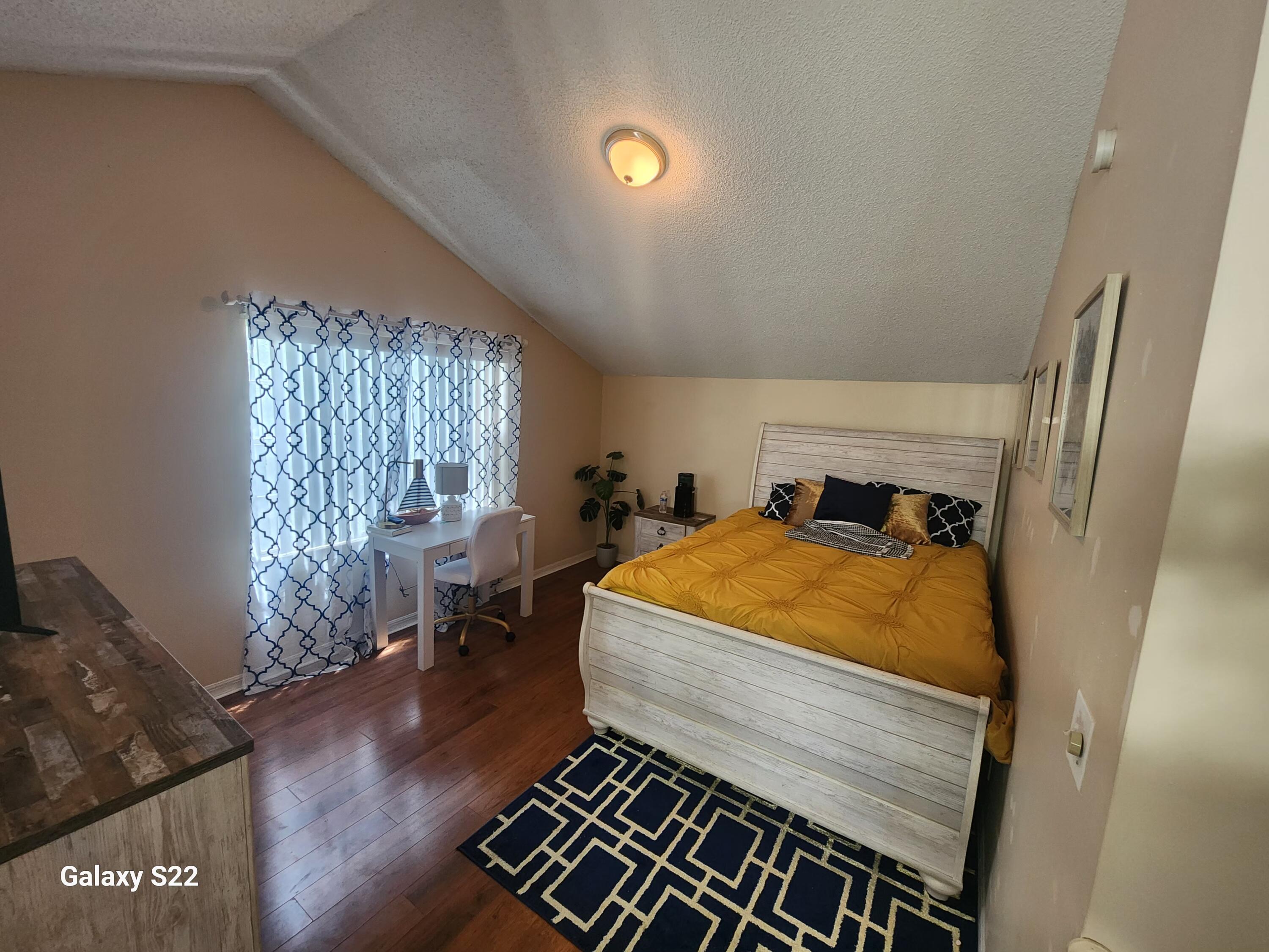 5884 Dewberry Way West Palm Beach, FL 33415 - Photo 19 of 26 a bedroom with a bed and wooden floor