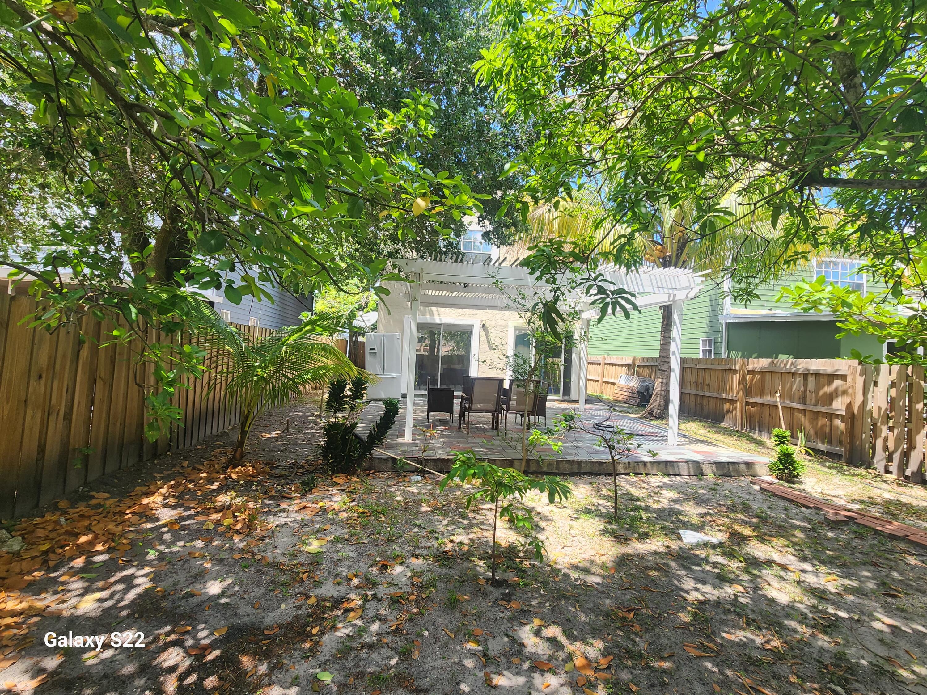 5884 Dewberry Way West Palm Beach, FL 33415 - Photo 2 of 26 a house view with a sitting space