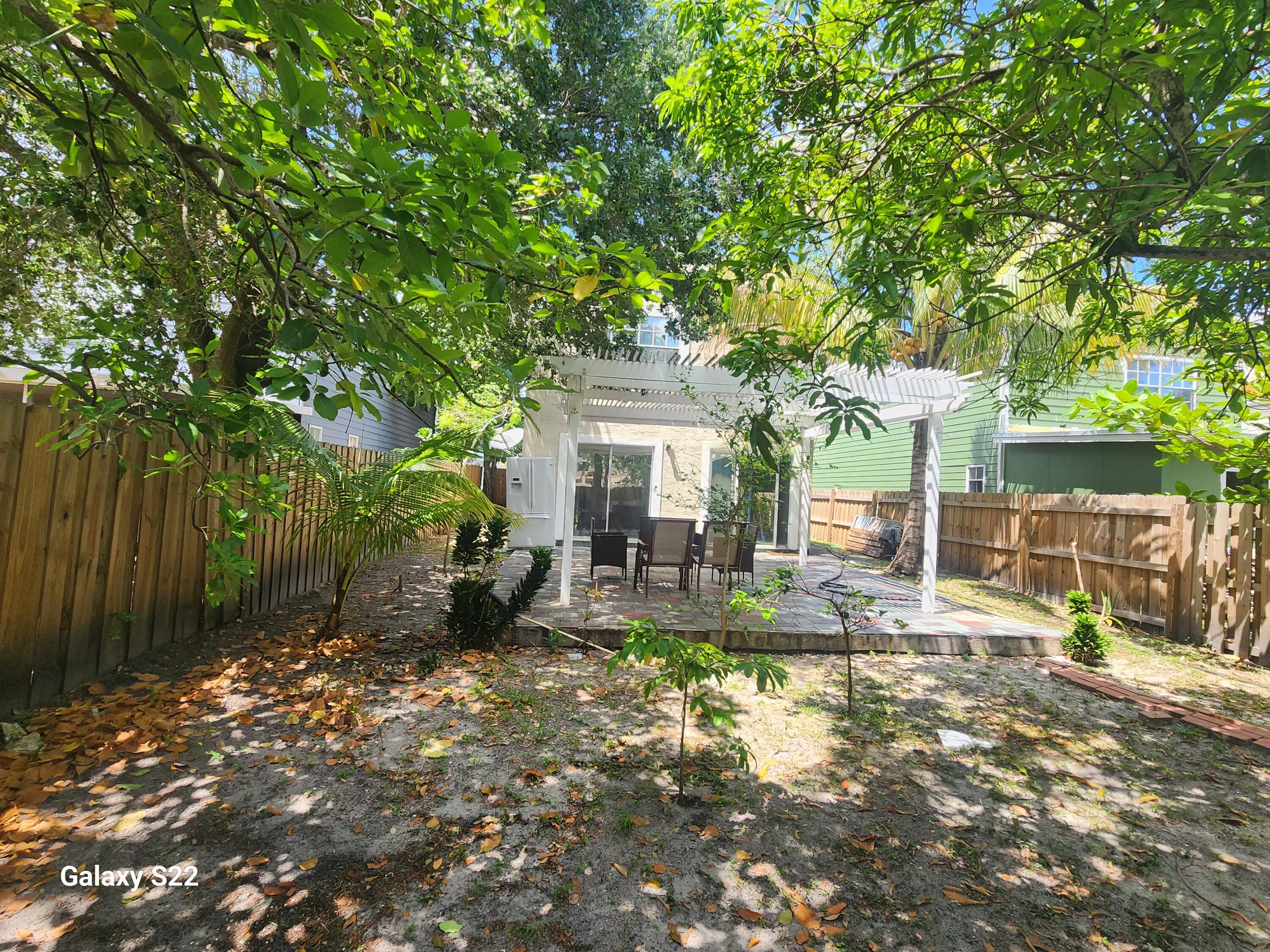 5884 Dewberry Way West Palm Beach, FL 33415 - Photo 25 of 26 a front view of a house with garden
