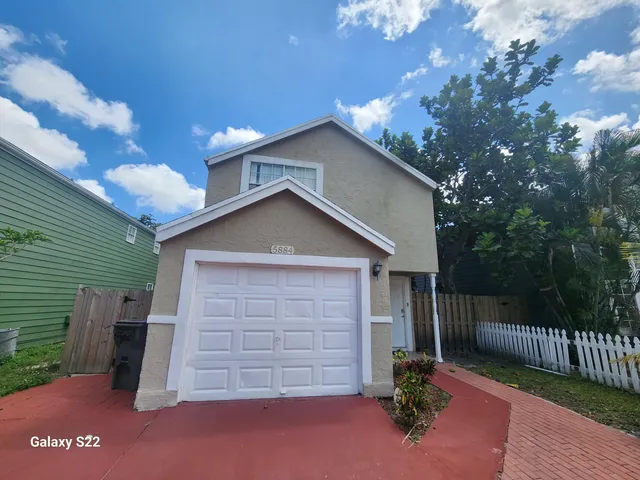 a front view of a house with a garage