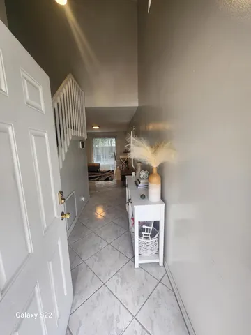 a view of a hallway with seating area