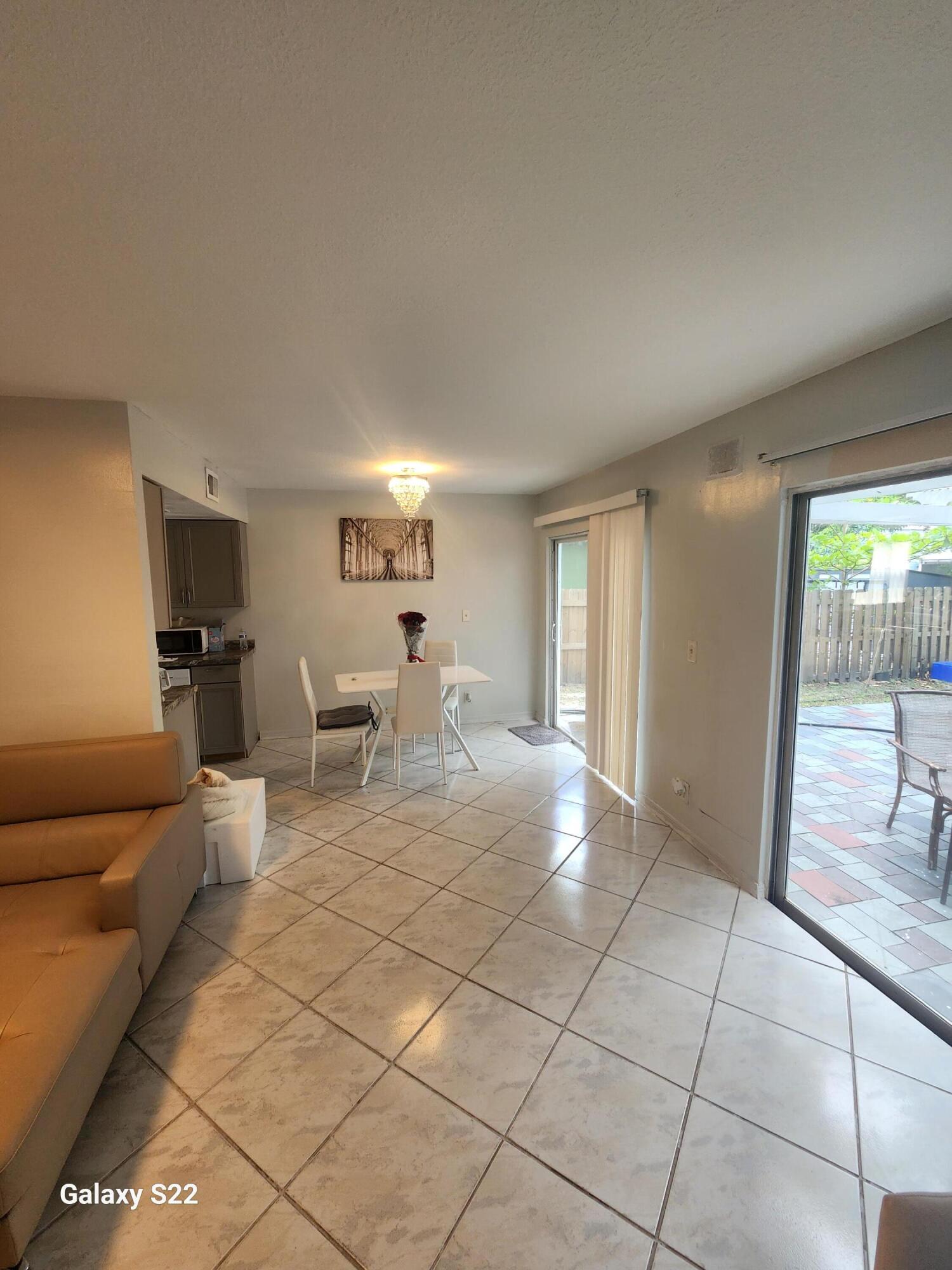 5884 Dewberry Way West Palm Beach, FL 33415 - Photo 9 of 26 a view of a livingroom with furniture and windows