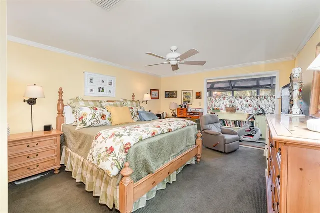 a bed room with bed and window