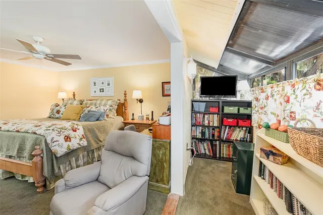 a view of a livingroom with furniture and a flat screen tv