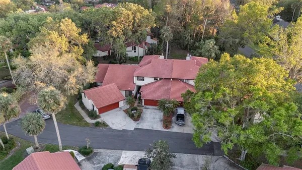 an aerial view of a houses with yard