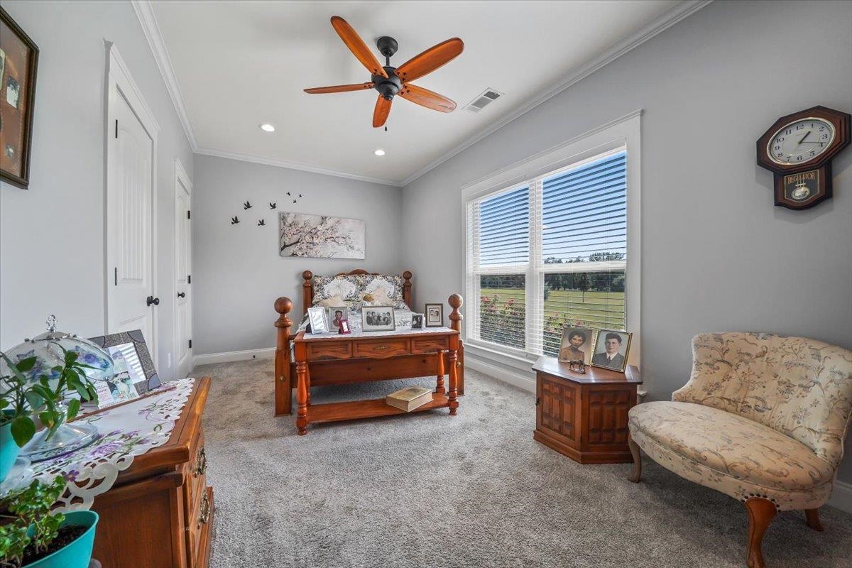 4374 Gainsville Road Mason, TN 38049 - Photo 22 of 40 Carpeted bedroom featuring crown molding, ceiling fan, and recessed lighting