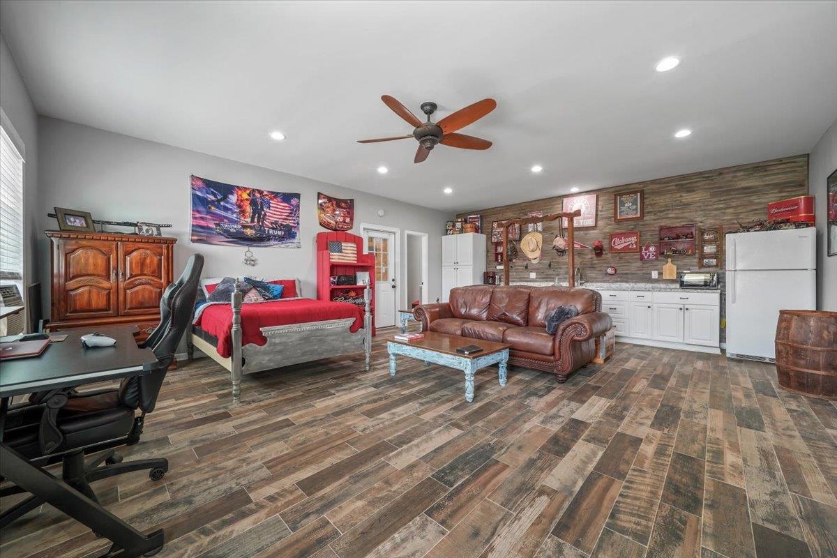 4374 Gainsville Road Mason, TN 38049 - Photo 28 of 40 Bedroom with freestanding refrigerator, recessed lighting, a desk, dark wood-type flooring, and ceiling fan