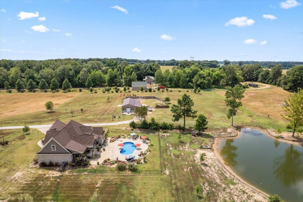 4374 Gainsville Road Mason, TN 38049 - Photo 37 of 40 Overview of rural landscape with a large body of water and a pool area