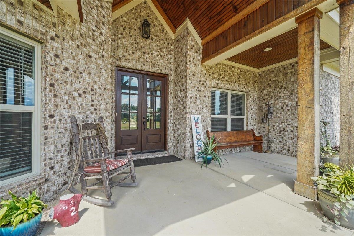 4374 Gainsville Road Mason, TN 38049 - Photo 5 of 40 View of exterior entry featuring a patio, brick siding, and french doors