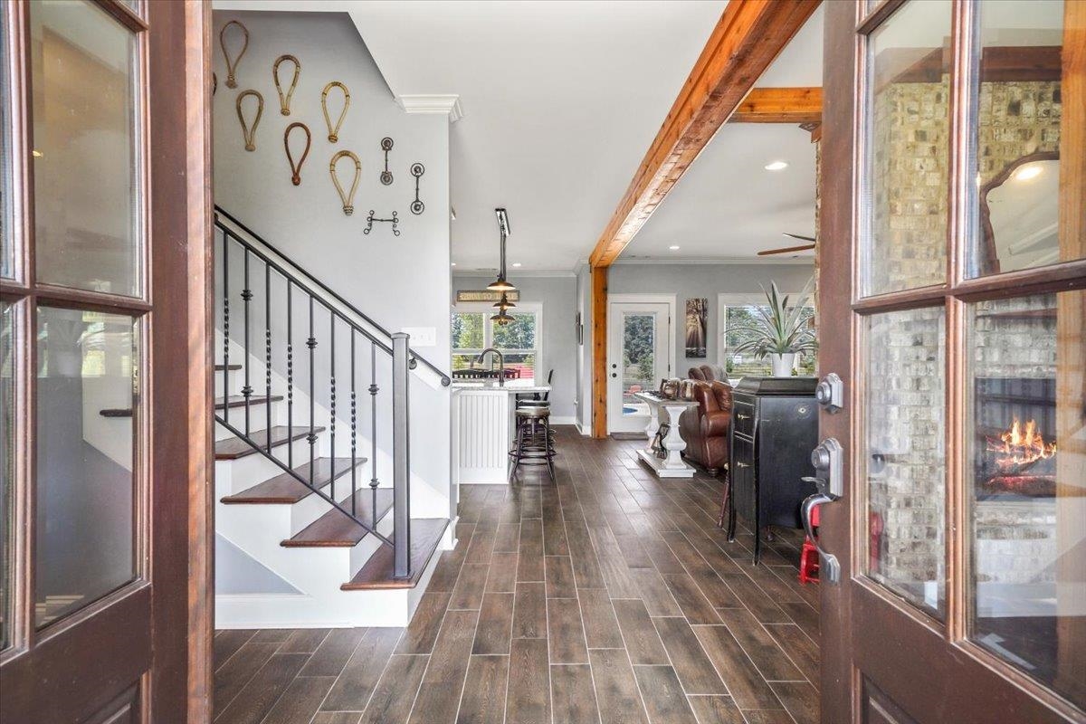 4374 Gainsville Road Mason, TN 38049 - Photo 6 of 40 Entryway featuring beam ceiling, dark wood finished floors, ornamental molding, recessed lighting, and stairway