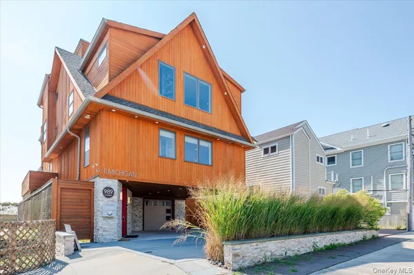 a view of a house with a yard and plants