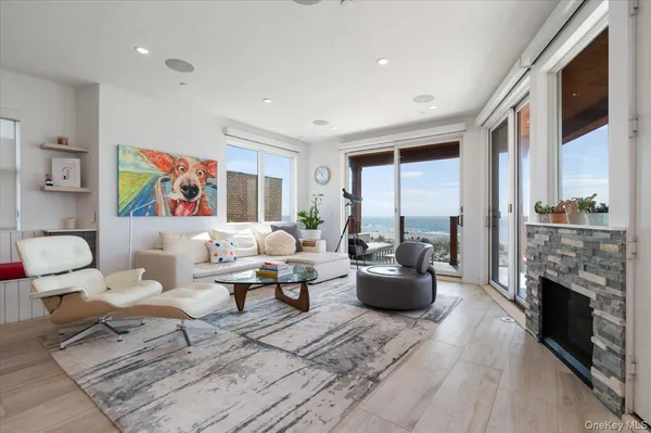 a living room with furniture fireplace and a table
