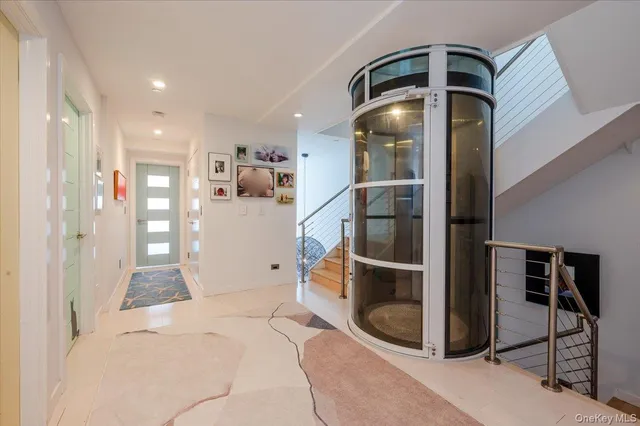 a view of a hallway view with staircase