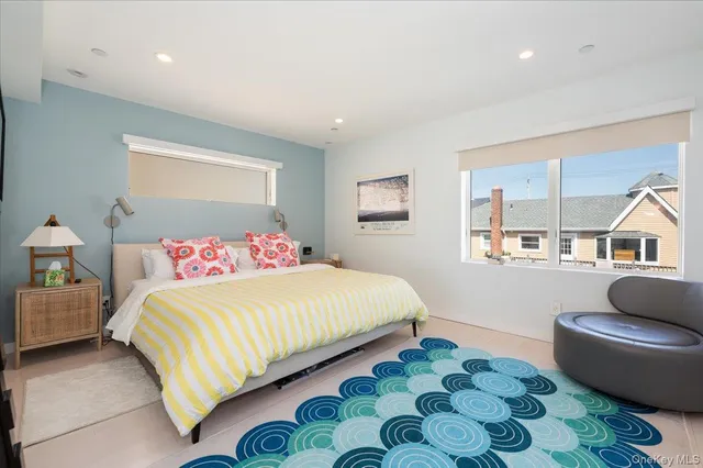 a bedroom with a bed and a couch