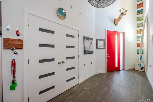 a view of a entryway with wooden floor