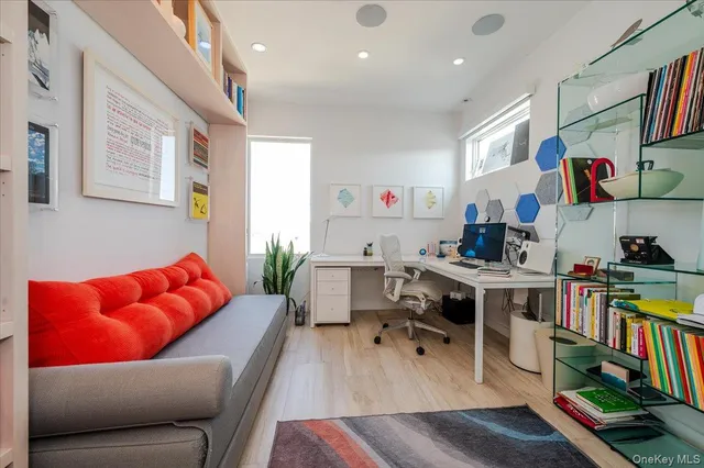 a workspace with furniture and a book shelf
