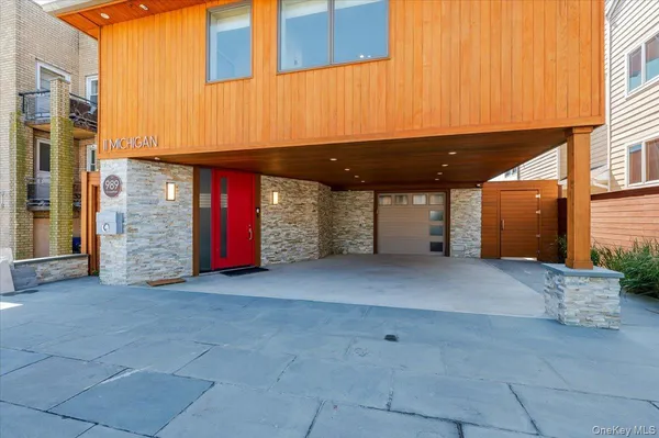 a view of building with door and outdoor seating