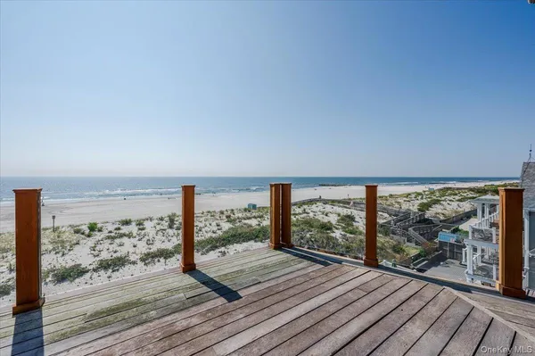 a view of a balcony with wooden floor