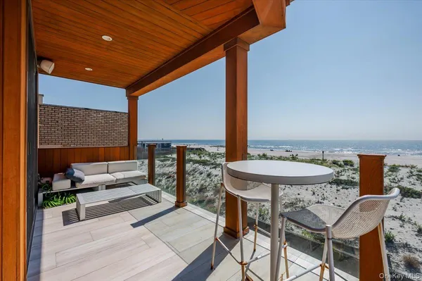 a view of a terrace with furniture and outside view