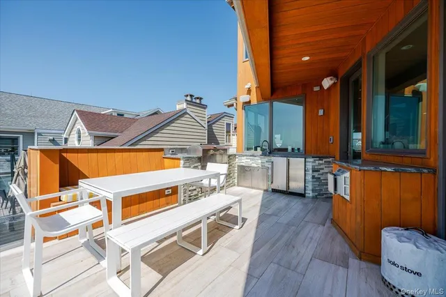 a view of a living room with furniture and kitchen view