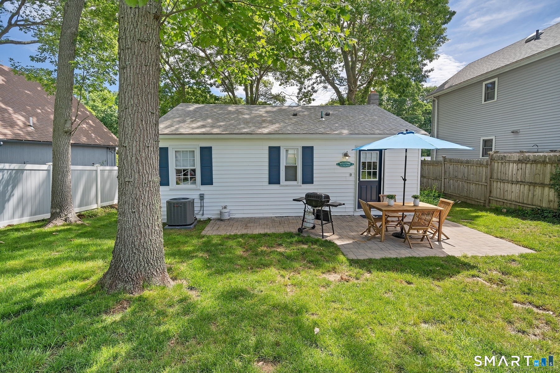 76 South Edgewood Road East Lyme, CT 06357 - Photo 18 of 18 a view of a house with backyard sitting area and garden