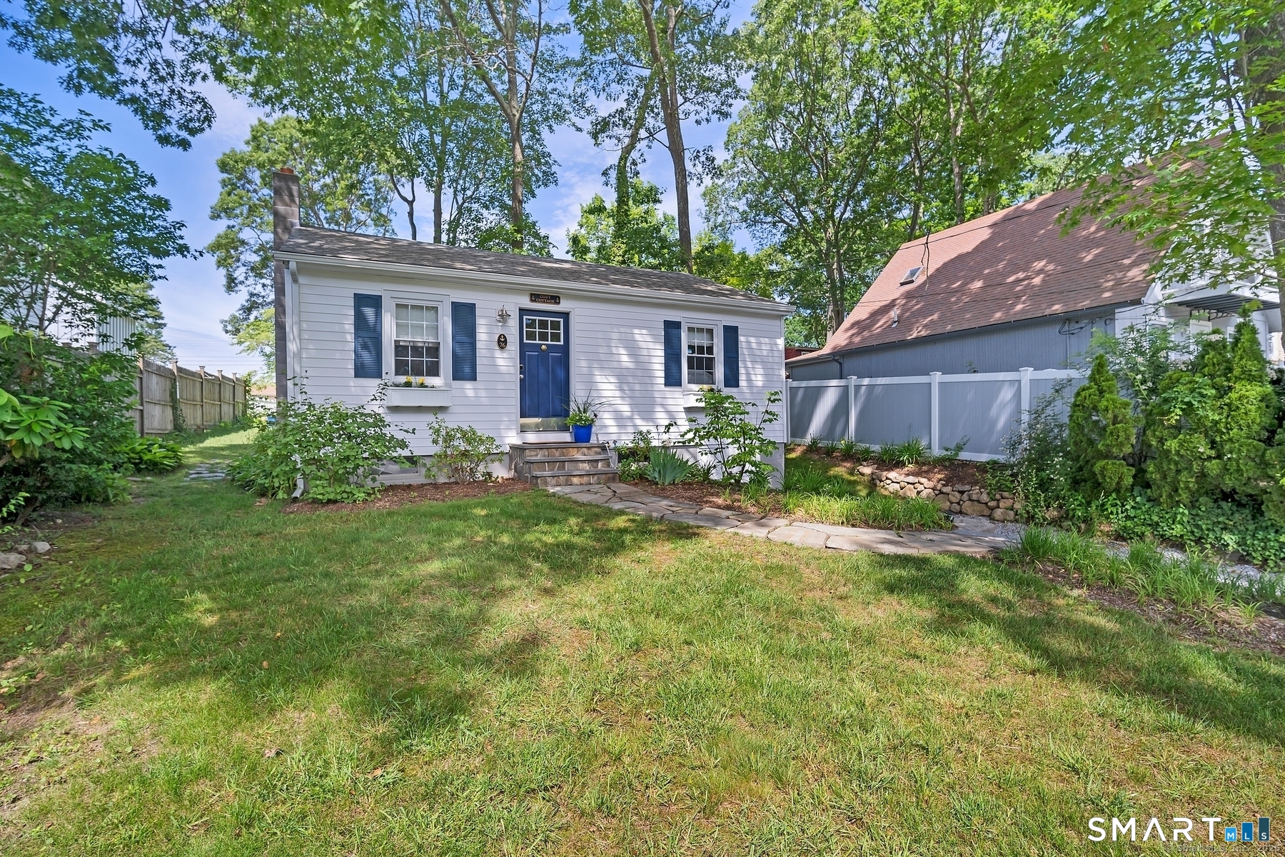76 South Edgewood Road East Lyme, CT 06357 - Photo 3 of 18 a front view of a house with garden