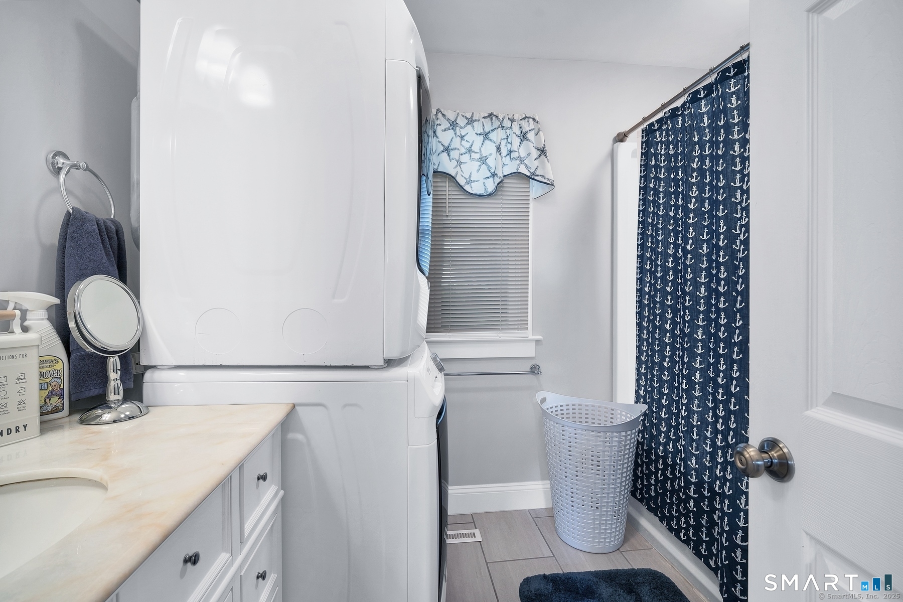 76 South Edgewood Road East Lyme, CT 06357 - Photo 9 of 18 a bathroom with a sink a toilet and a mirror
